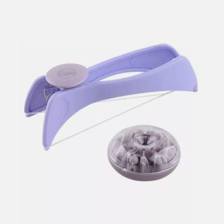 Purple hair tie with a clear container on a white background