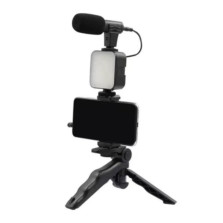 Phone holder with microphone and light on a white background