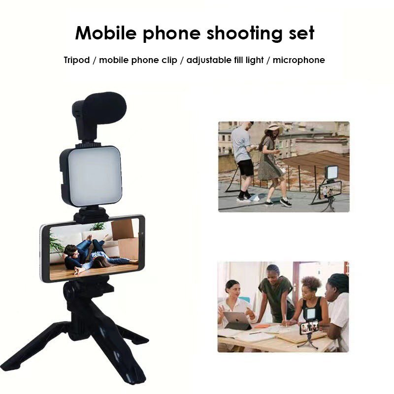 Mobile phone shooting set with tripod, clip, fill light, and microphone on a white background.